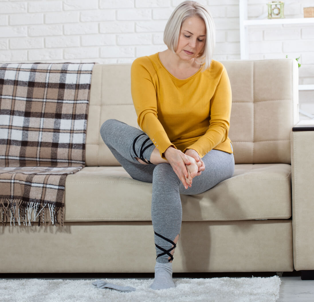 Senior checking feet